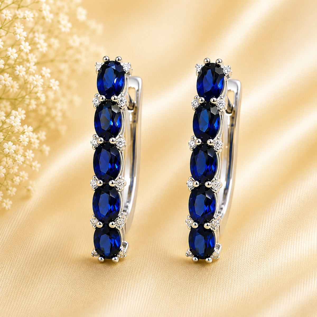 Лабораторные серьги из серебра с синим сапфиром и муассанитом